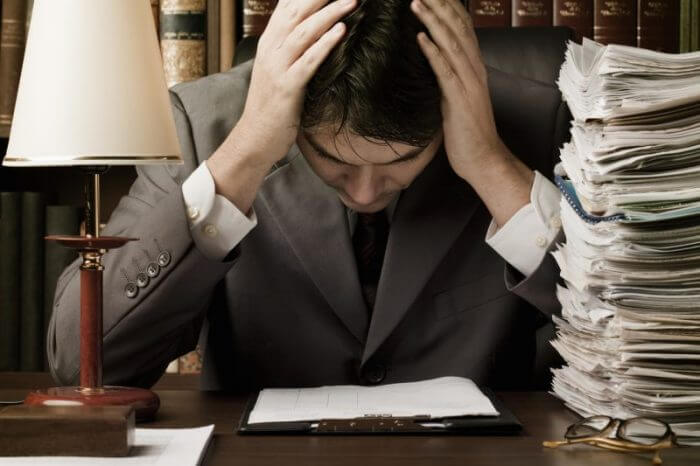 Man in suit stressed by work
