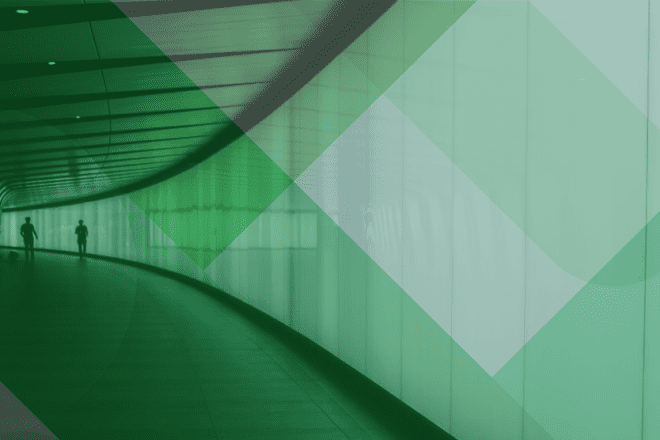 Image of tunnel with two people and a dog at the end with green filter