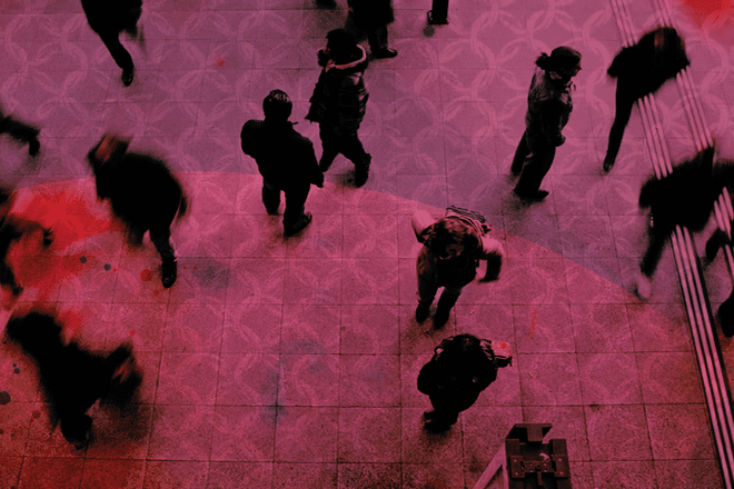 Aerial view of people walking with red filter